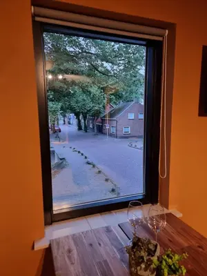 a window with a view of a street at Aan de Burgwal in Enkhuizen