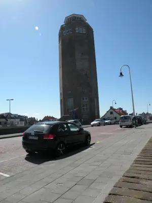 a black car parked in front of a building at Apartment de Boer in Zandvoort