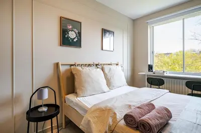 a bedroom with a bed with two towels on it at Amsterdam Centraal in 10 minutes - nearby metro in Amsterdam