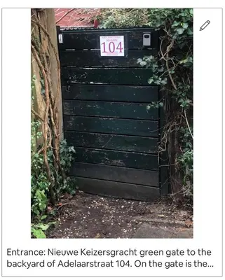 a black gate with a sign on top of it at Tiny house for 2 with private garden in Utrecht