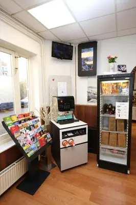 a kitchen with a refrigerator and a stove at Hotel Flipper Amsterdam in Amsterdam