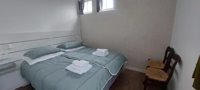 a bedroom with a bed with towels on it at Bickersbed in Amsterdam