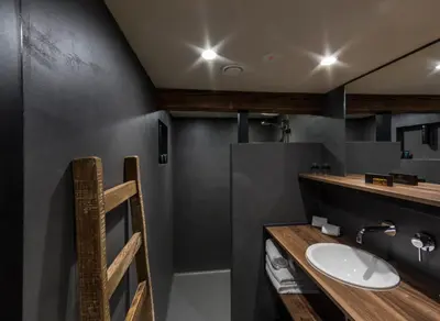 a bathroom with a sink and a mirror at Van Rossum Stadshotel Woerden in Woerden