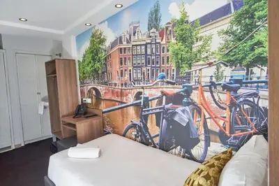 a room with two bikes on the wall at The Townhouse Hotel in Amsterdam
