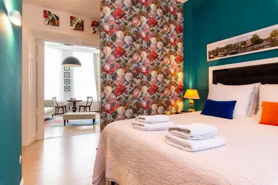 a bedroom with a bed with towels on it at B&B Blossom in Amsterdam