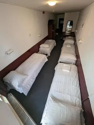 a row of beds in a dorm room at Budget Hotel Ben in Amsterdam