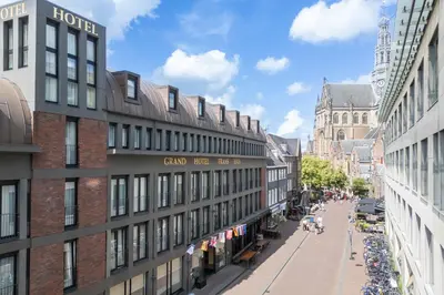 a view of a street in a city with buildings at Amrâth Grand Hotel Frans Hals in Haarlem
