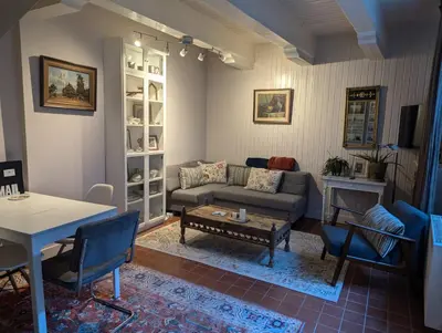 a living room with a couch and a table at Het Pakhuis Haarlem in Haarlem