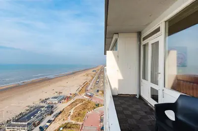 a view of the beach from the balcony of a building at Seaside in Zandvoort