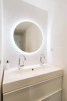 a bathroom with a sink and a mirror at The Prinsen in Amsterdam