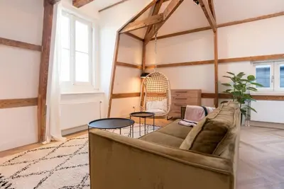 a living room with a couch and a table at The Prinsen in Amsterdam