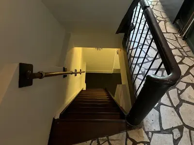 a staircase with a metal railing and a stair case at Weber Hotel in Amsterdam