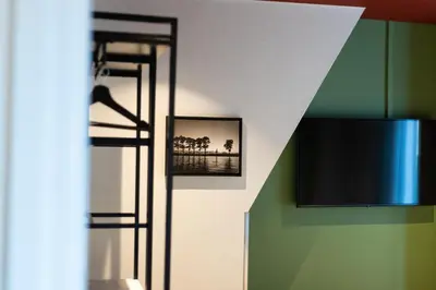 a room with a door with a picture on the wall at Weber Hotel in Amsterdam