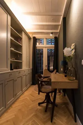 a dining room with a table and a window at B&B Felix in Amsterdam