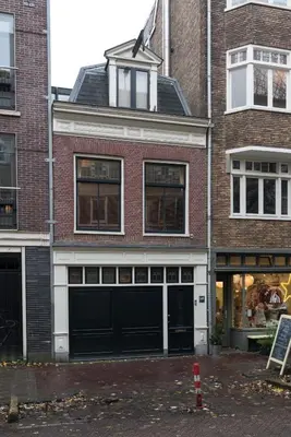 a large brick building with two garages at B&B Felix in Amsterdam