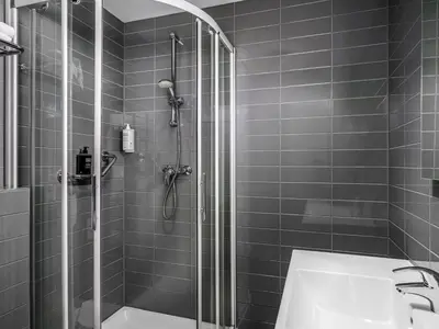 a bathroom with a shower and a sink at ibis Styles Amsterdam Amstel in Amsterdam