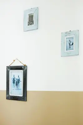 four pictures are hanging on a wall at Het Krekeltje in Zandvoort