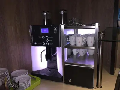 a coffee maker with mugs in a kitchen at Mozart Hotel in Amsterdam