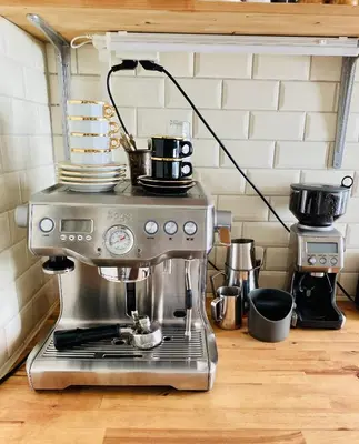a coffee maker sitting on top of a kitchen counter at Familiehuis aan zee met ruim dakterras in Zandvoort