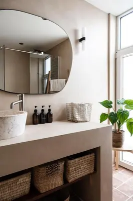 a bathroom with a sink and a mirror at Familiehuis aan zee met ruim dakterras in Zandvoort