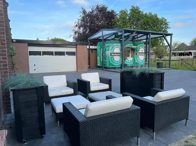 a group of chairs and tables in a parking lot at Luxe woning Bubbles! Met airco en Parkeren op eigen grond in Castricum