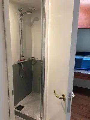 a shower in a bathroom with a glass door at Klipper Johanna in Monnickendam