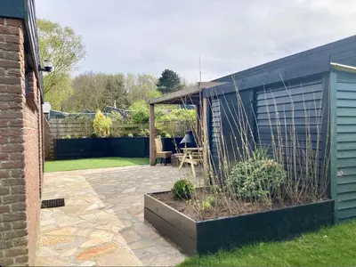 a patio with a gazebo in a yard at NEW: Summerhouse near beach&lake in Noordwijkerhout