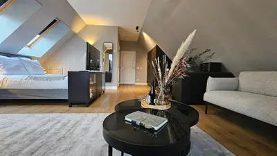a living room with a bed and a table at Guest Room Utrecht in Utrecht