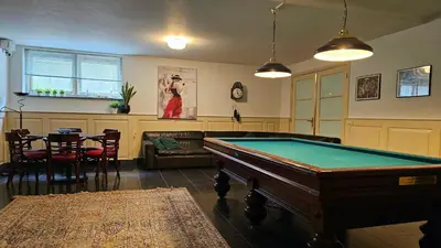 a living room with a pool table in it at Guest Room Utrecht in Utrecht