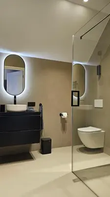 a bathroom with a sink and a toilet and a mirror at Guest Room Utrecht in Utrecht