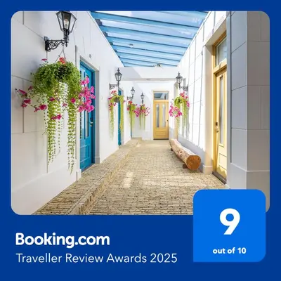 a walkway in a building with flowers on it at Grapèlli Boutique Hotel in Alkmaar