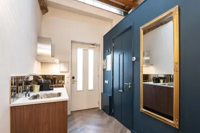a bathroom with a sink and a mirror at Grapèlli Boutique Hotel in Alkmaar