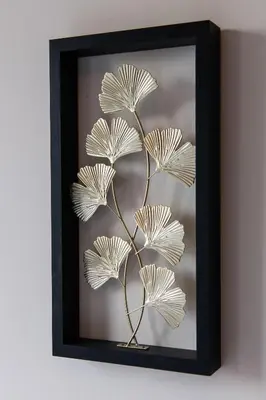 a metal plant in a picture frame on a wall at Aparthotel North Spacious Studio for two in Amsterdam