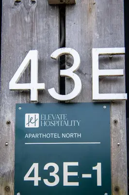a sign on a wooden wall with the number at Aparthotel North Spacious Studio for two in Amsterdam