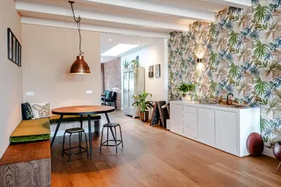 a kitchen and dining room with a table and chairs at Luxurious Family Home Amstelveen in Amstelveen