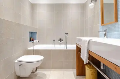 a bathroom with a toilet and a sink and a tub at Luxurious Family Home Amstelveen in Amstelveen