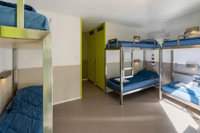 a bunk bed room with three bunk beds in it at Stayokay Hostel Haarlem in Haarlem
