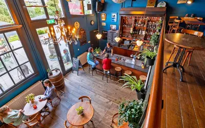 an overhead view of a restaurant with people sitting at tables at Stayokay Hostel Haarlem in Haarlem