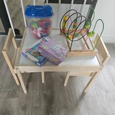 a small wooden table with some toys on it at Il Mulino House B in Lisse