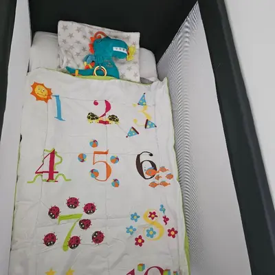 a bed with a white sheet with numbers on it at Il Mulino House B in Lisse