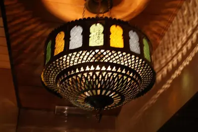 a chandelier hanging from a ceiling in a room at Nadia Hotel in Amsterdam