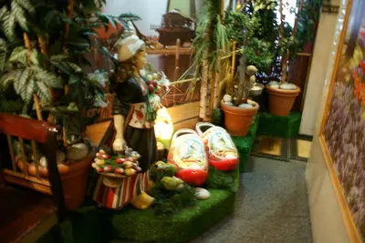 a figurine of a woman standing in a room with vegetables at Nadia Hotel in Amsterdam