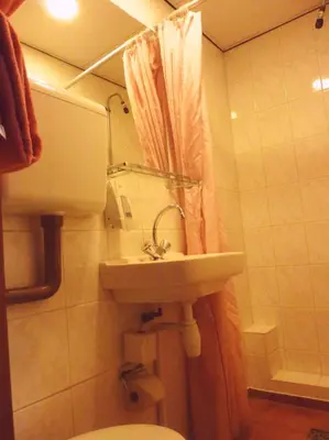 a bathroom with a sink and a toilet at Nadia Hotel in Amsterdam