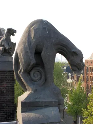 a statue of a dog with its head on a building at Nadia Hotel in Amsterdam