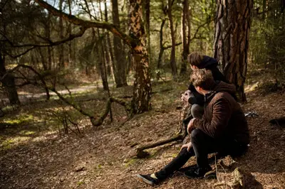 a group of people sitting in the woods at Buitenplaats de Bergse Bossen in Driebergen