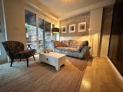a living room with a couch and a coffee table at Villa Park in Bennebroek
