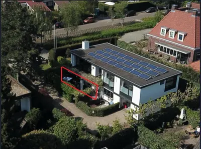 an aerial view of a house with solar panels on the roof at Villa Park in Bennebroek
