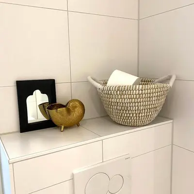 two baskets sitting on a shelf in a bathroom at Sterflat 189 in Egmond aan Zee