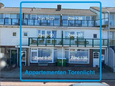 an image of an apartment building with numbers on it at Torenlicht in Egmond aan Zee