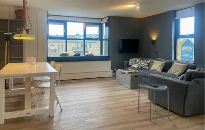 a living room with a couch and a table at Gorgeous Apartment In Bergen Aan Zee in Bergen aan Zee